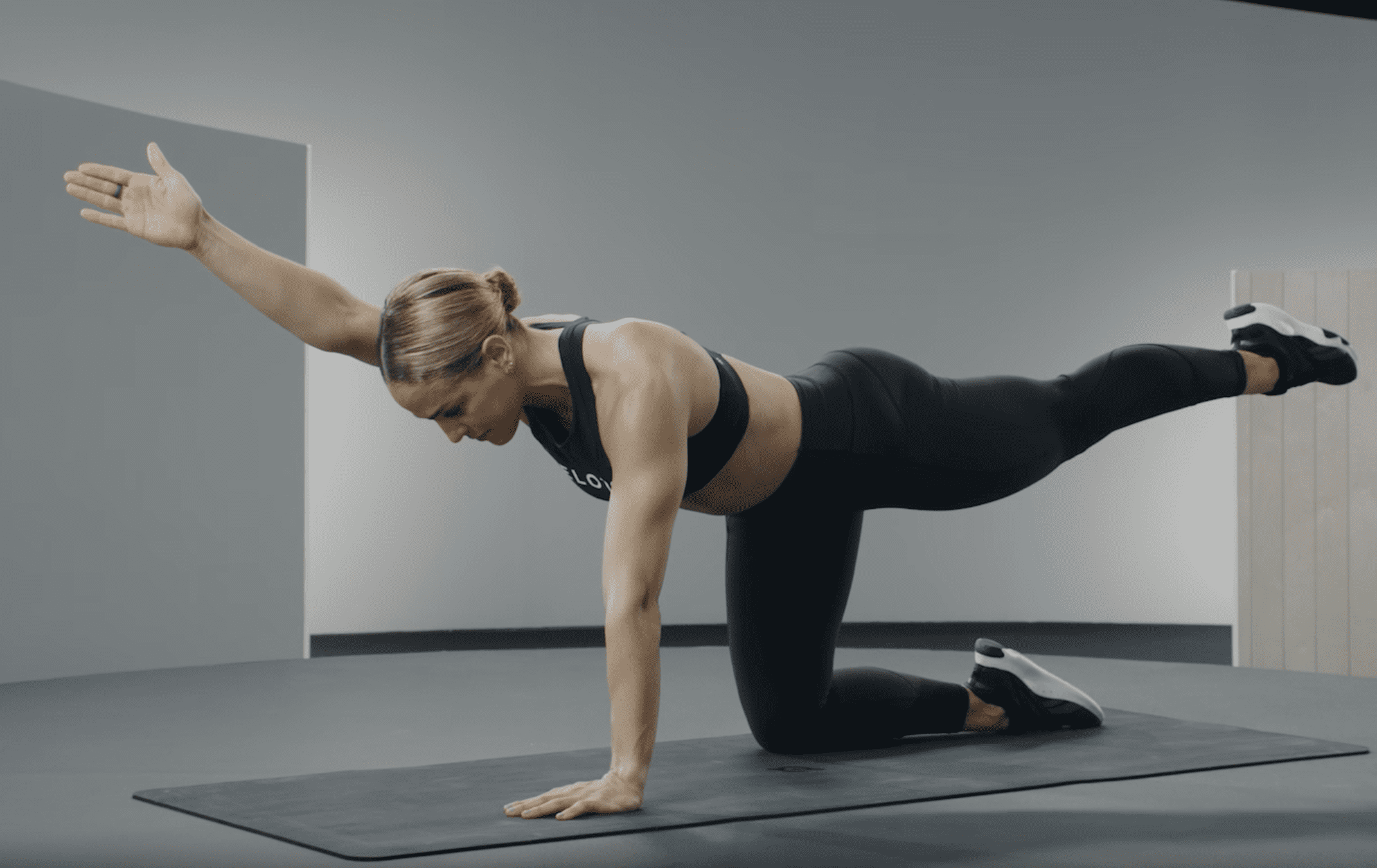 a woman doing a exercise at home